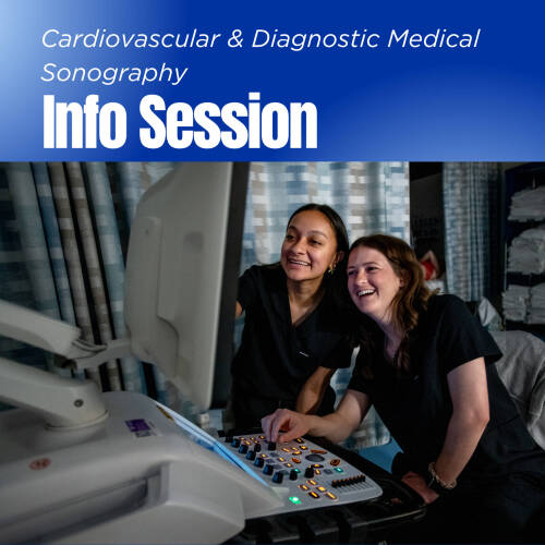 two sonography students smile and look at a monitor